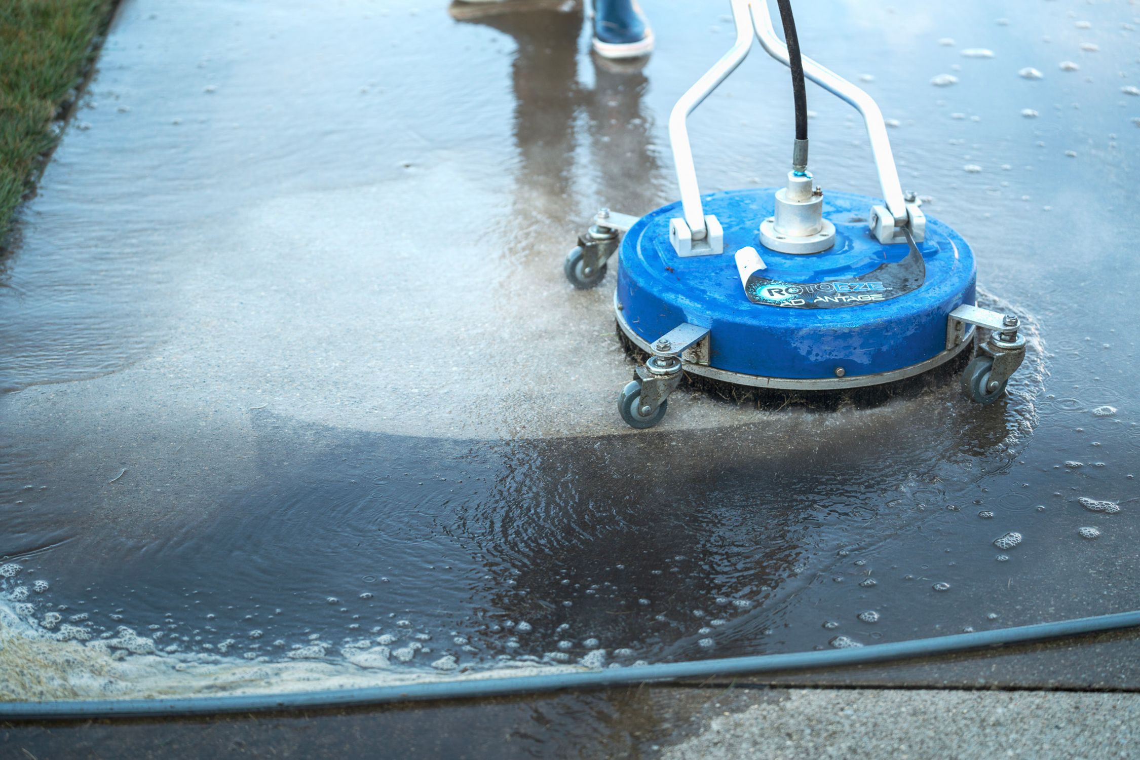 pressure washing a driveway in Grand Rapids, Michigan