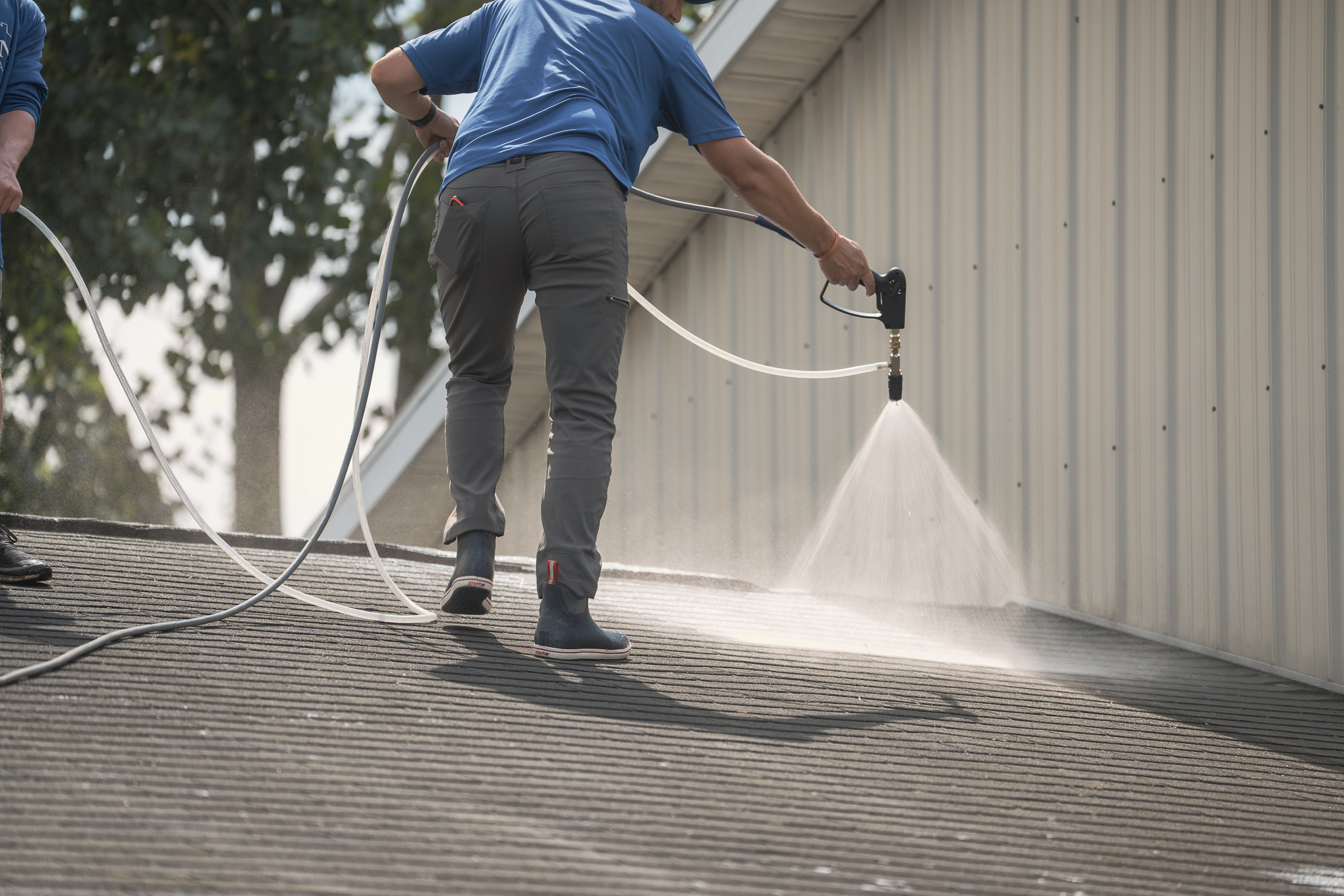 soft washing a home exterior in West Michigan