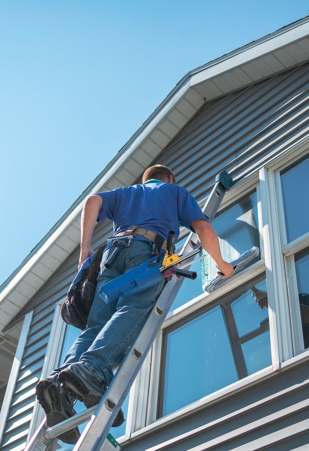 window cleaner on a ladder
